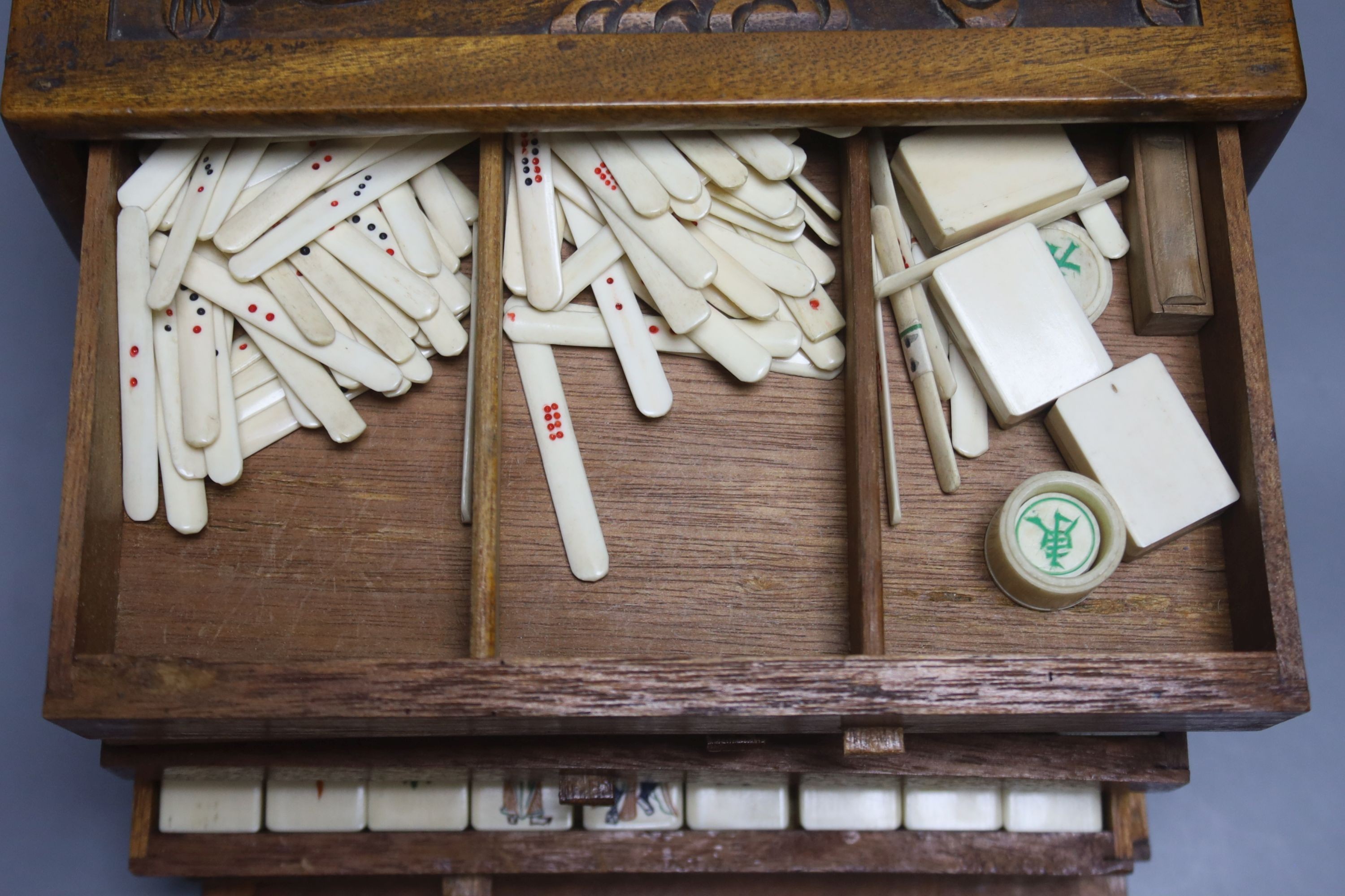 A Chinese hardwood cased mah jong set